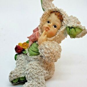Snow bunny dressed in a Spaghetti Bunny Suite Figurine Cute Little Face too